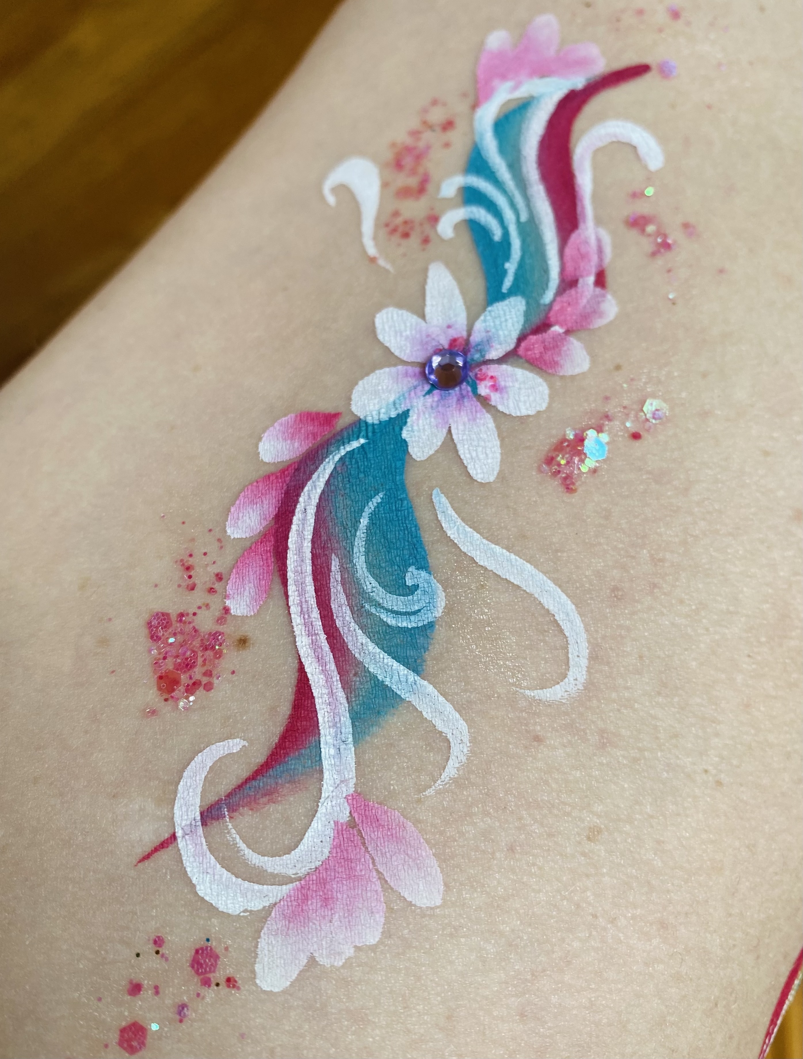 Face painting by Sparkle Motion