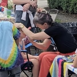 Face painting by Sparkle Motion